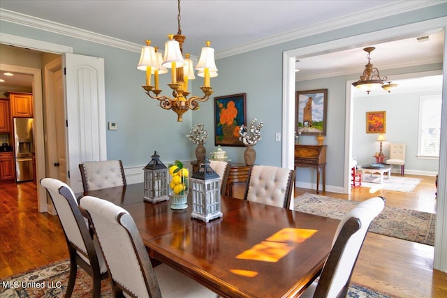 dining space with ornamental molding, dark hardwood / wood-style floors, and an inviting chandelier