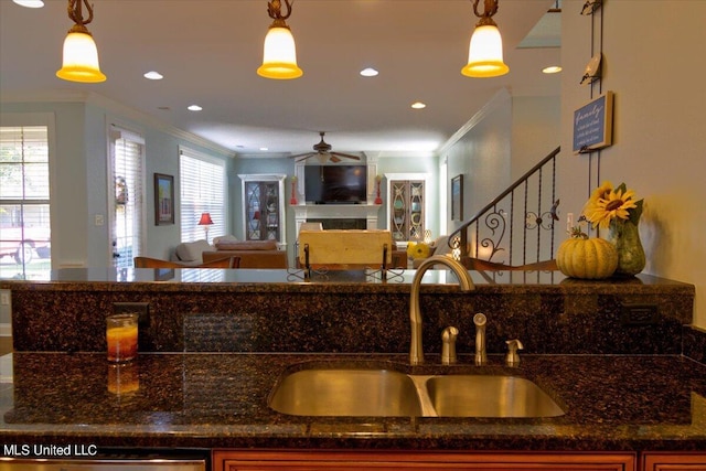 kitchen with sink, hanging light fixtures, and plenty of natural light