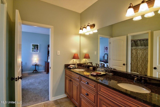 bathroom with vanity, walk in shower, and tile patterned flooring