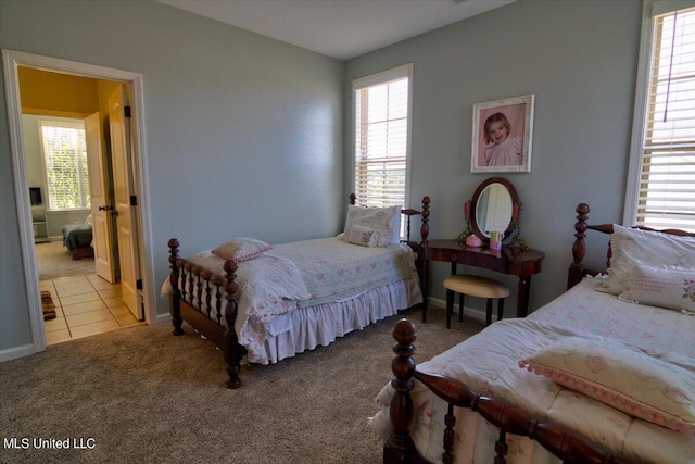 bedroom featuring multiple windows and carpet floors