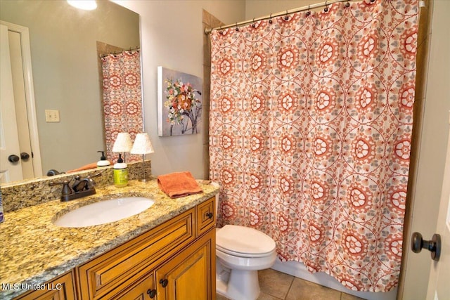 bathroom with vanity, toilet, tile patterned floors, and a shower with shower curtain