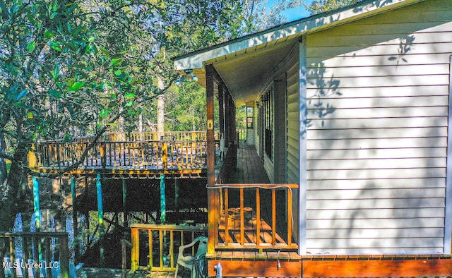 view of side of home featuring a wooden deck