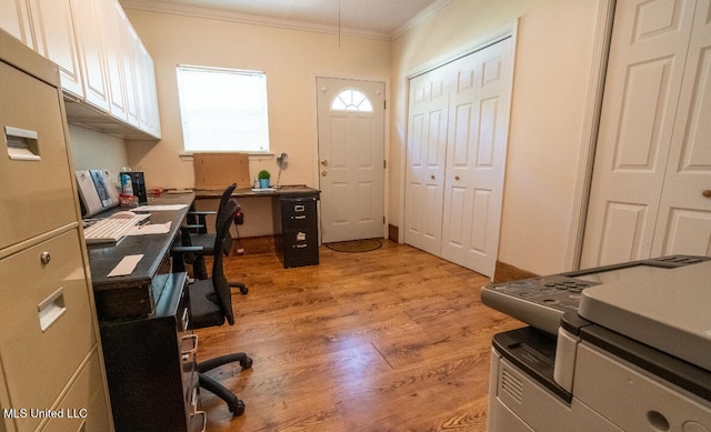 home office featuring ornamental molding and light wood-type flooring