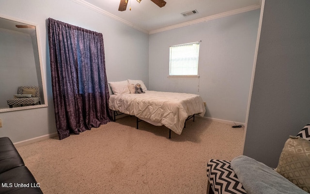 bedroom with crown molding, carpet floors, and ceiling fan