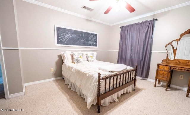 carpeted bedroom with ceiling fan and ornamental molding