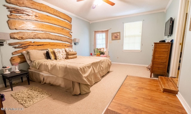 bedroom featuring crown molding, hardwood / wood-style floors, and ceiling fan