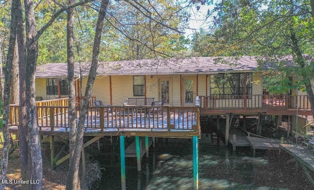 back of property with a deck