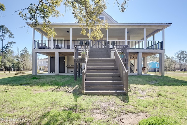 view of front facade featuring stairs and a front lawn