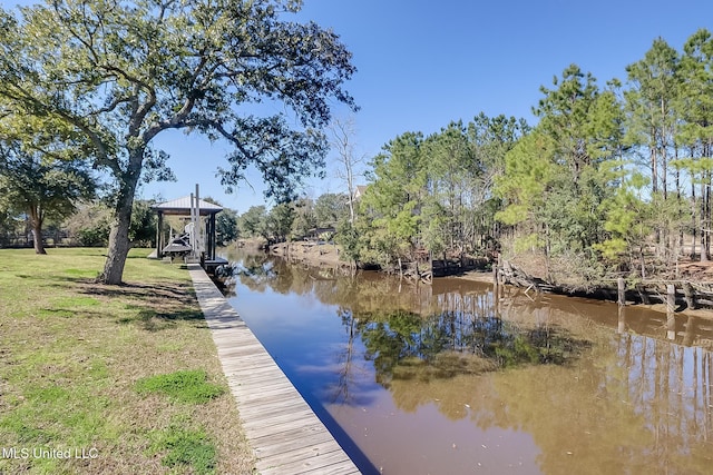 view of dock featuring a yard and a water view