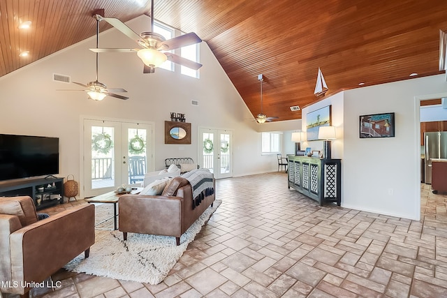 living area with visible vents, french doors, wood ceiling, and baseboards