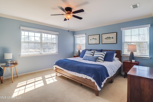 bedroom featuring light colored carpet, visible vents, crown molding, and baseboards