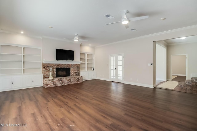 unfurnished living room featuring visible vents, ceiling fan, baseboards, and wood finished floors