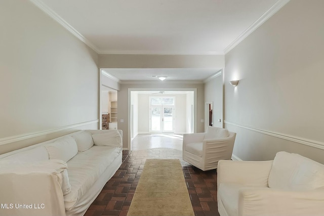 living room with crown molding and baseboards