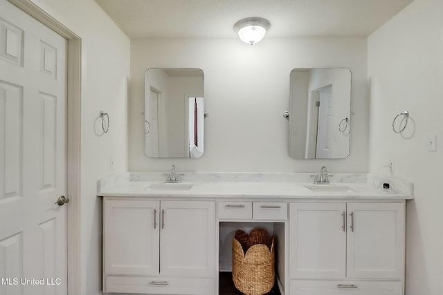 bathroom with double vanity and a sink