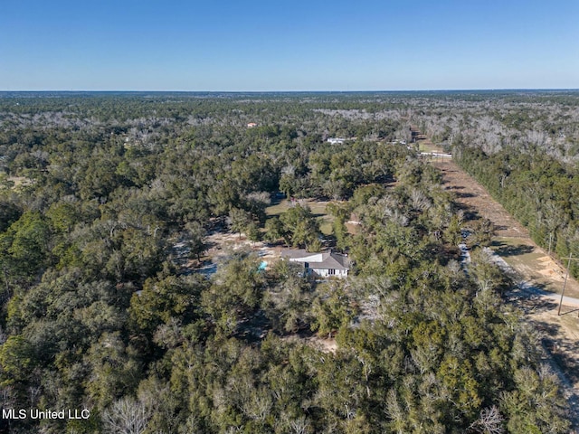 bird's eye view featuring a wooded view