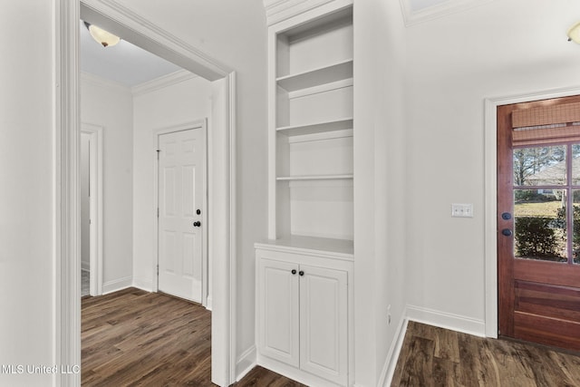 interior space with dark hardwood / wood-style floors, built in features, and crown molding