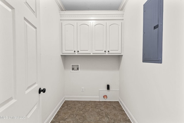 laundry area with electric panel, crown molding, cabinets, and washer hookup