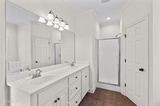 bathroom featuring tile patterned flooring, ornamental molding, vanity, and a shower with shower door