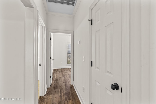 hallway with crown molding and dark wood-type flooring