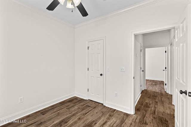 unfurnished bedroom featuring ceiling fan, dark hardwood / wood-style floors, and ornamental molding