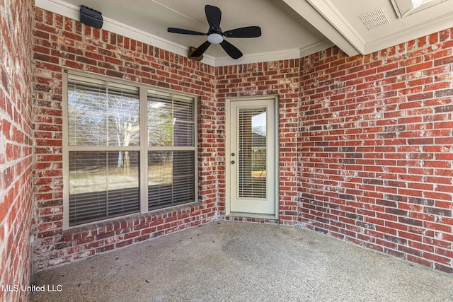 property entrance with ceiling fan and a patio