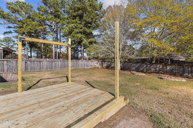 wooden terrace with a yard