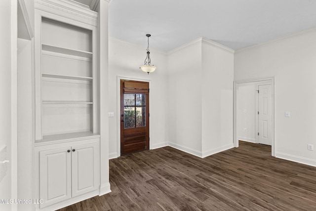 entryway featuring dark hardwood / wood-style floors and ornamental molding