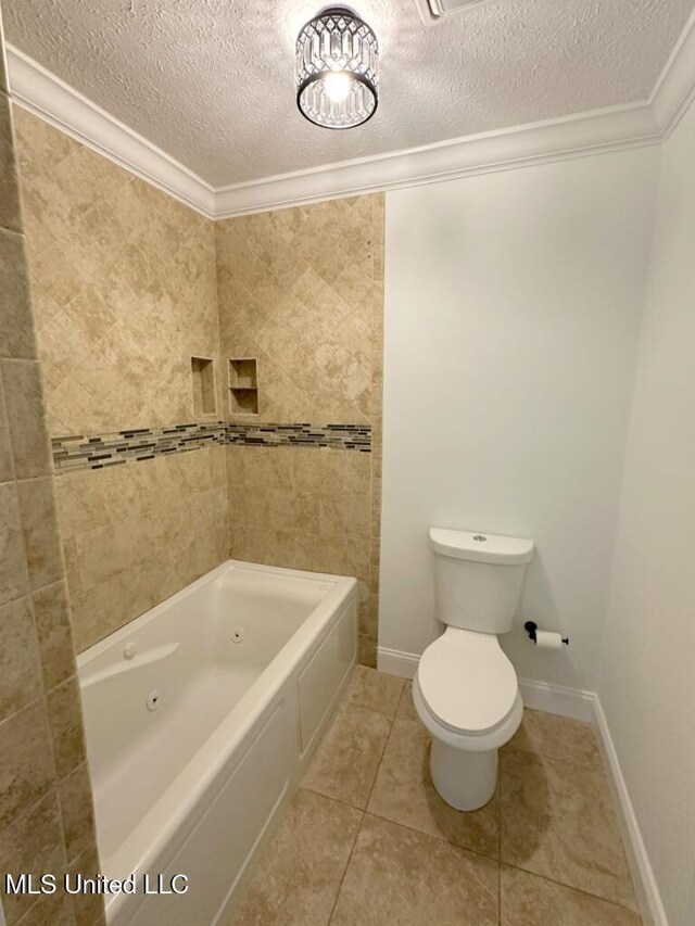 bathroom with a textured ceiling, toilet, crown molding, and tile patterned flooring