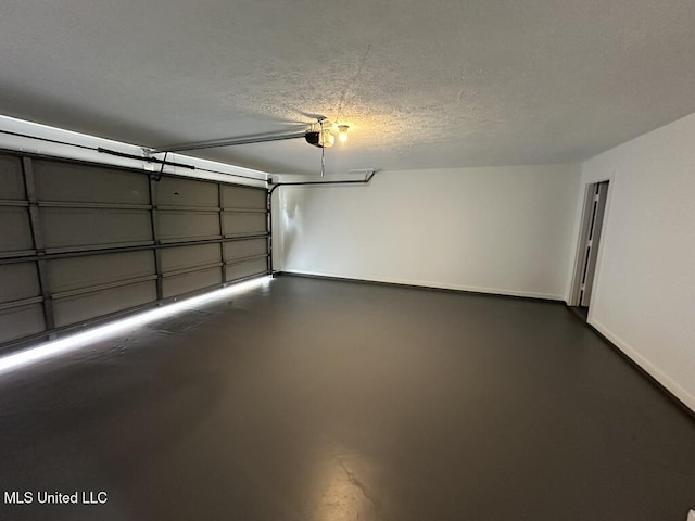 garage with baseboards and a garage door opener