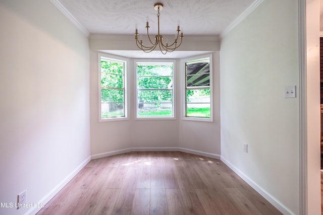 18 Crossgates Dr, Brandon, MS 39042 - unfurnished dining area with a chandelier, wood finished floors, baseboards, and crown molding