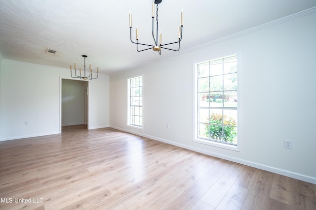18 Crossgates Dr, Brandon, MS 39042 - empty room with a chandelier, ornamental molding, light wood-style flooring, and baseboards