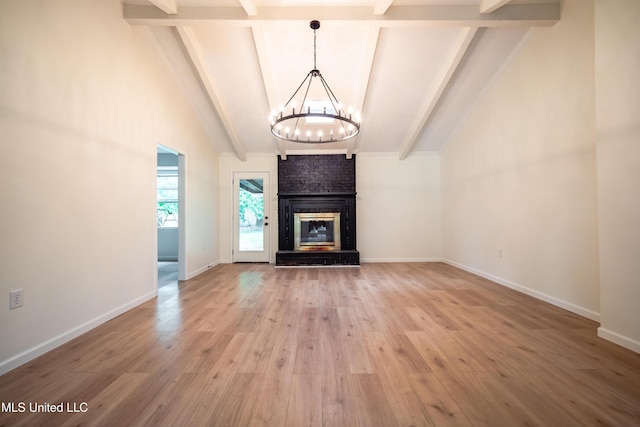 18 Crossgates Dr, Brandon, MS 39042 - unfurnished living room with a chandelier, light wood-style flooring, baseboards, and a fireplace