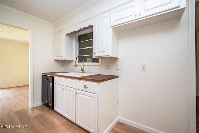 18 Crossgates Dr, Brandon, MS 39042 - kitchen with a sink, wood counters, light wood-type flooring, dishwasher, and baseboards