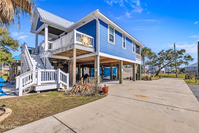 view of front of home with a carport