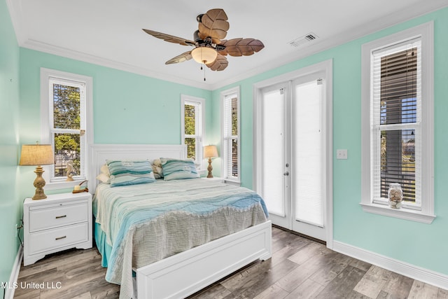 bedroom with ceiling fan, hardwood / wood-style flooring, crown molding, and access to exterior