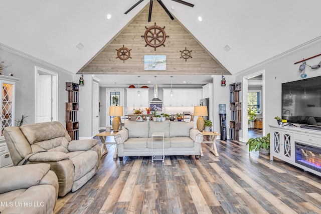 living room with high vaulted ceiling, hardwood / wood-style flooring, and ornamental molding