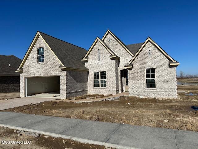 view of front of property with a garage