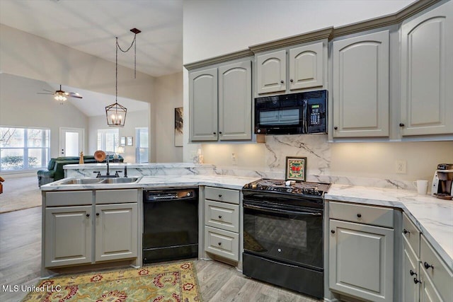 kitchen with gray cabinets, ceiling fan, and black appliances