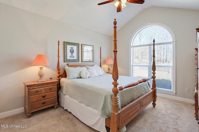 bedroom with ceiling fan, light colored carpet, and vaulted ceiling