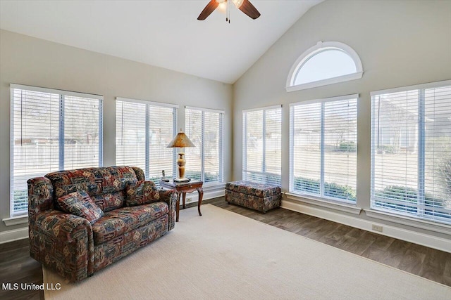 sunroom with a wealth of natural light, vaulted ceiling, and ceiling fan