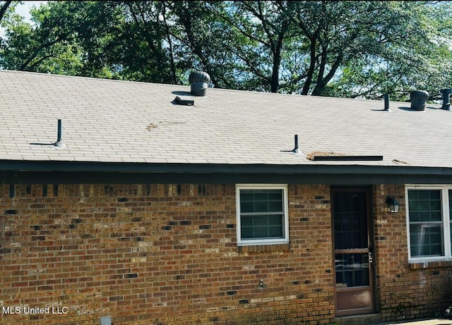 exterior space featuring brick siding