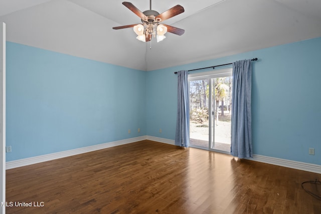 unfurnished room with ceiling fan, baseboards, wood finished floors, and vaulted ceiling