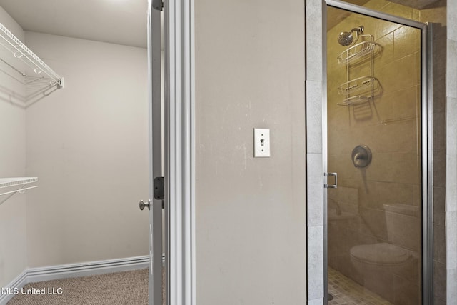 full bath featuring baseboards and a stall shower