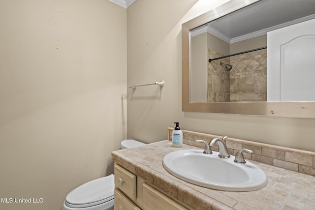 bathroom with a shower, toilet, vanity, and ornamental molding