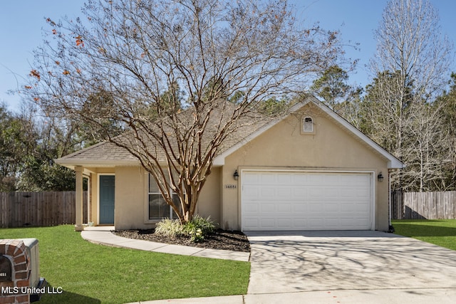 view of front of home with a garage and a front yard