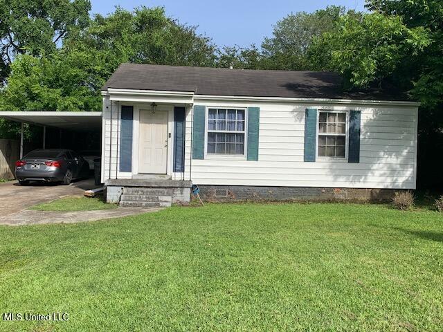 1509 Eastwood Rd, Natchez, MS 39120 - view of front of property with crawl space, a carport, a front lawn, and concrete driveway