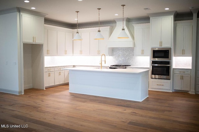 256 Arbor Trl, Brandon, MS 39047 - kitchen with oven, custom exhaust hood, a center island with sink, decorative backsplash, and recessed lighting