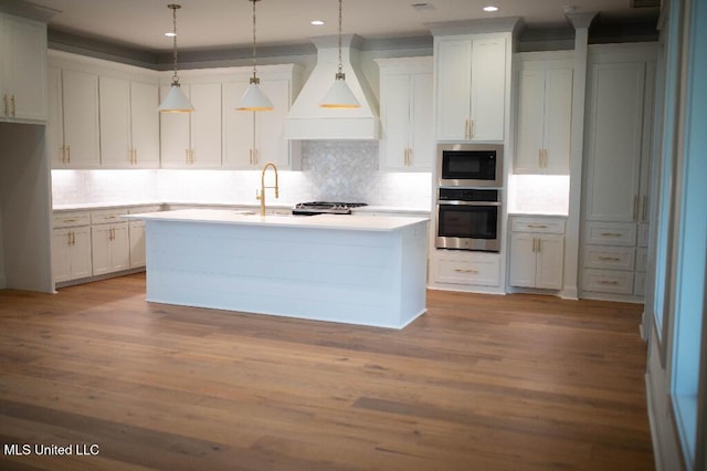 256 Arbor Trl, Brandon, MS 39047 - kitchen with oven, premium range hood, a sink, tasteful backsplash, and recessed lighting