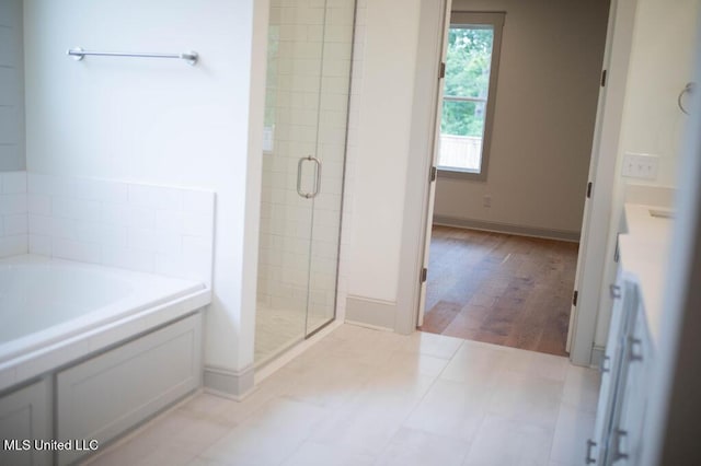 256 Arbor Trl, Brandon, MS 39047 - bathroom with a stall shower, a garden tub, and baseboards