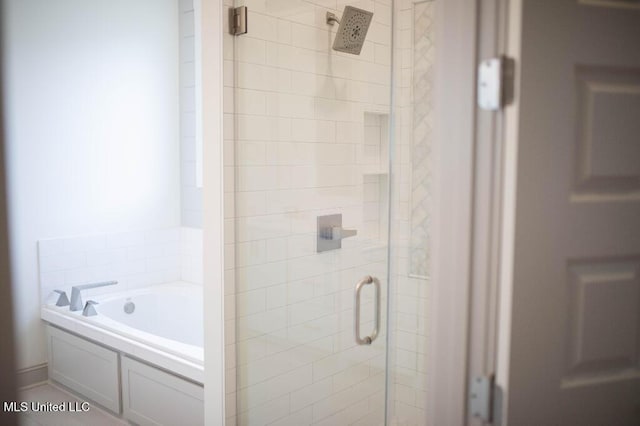 256 Arbor Trl, Brandon, MS 39047 - bathroom featuring a stall shower and a garden tub
